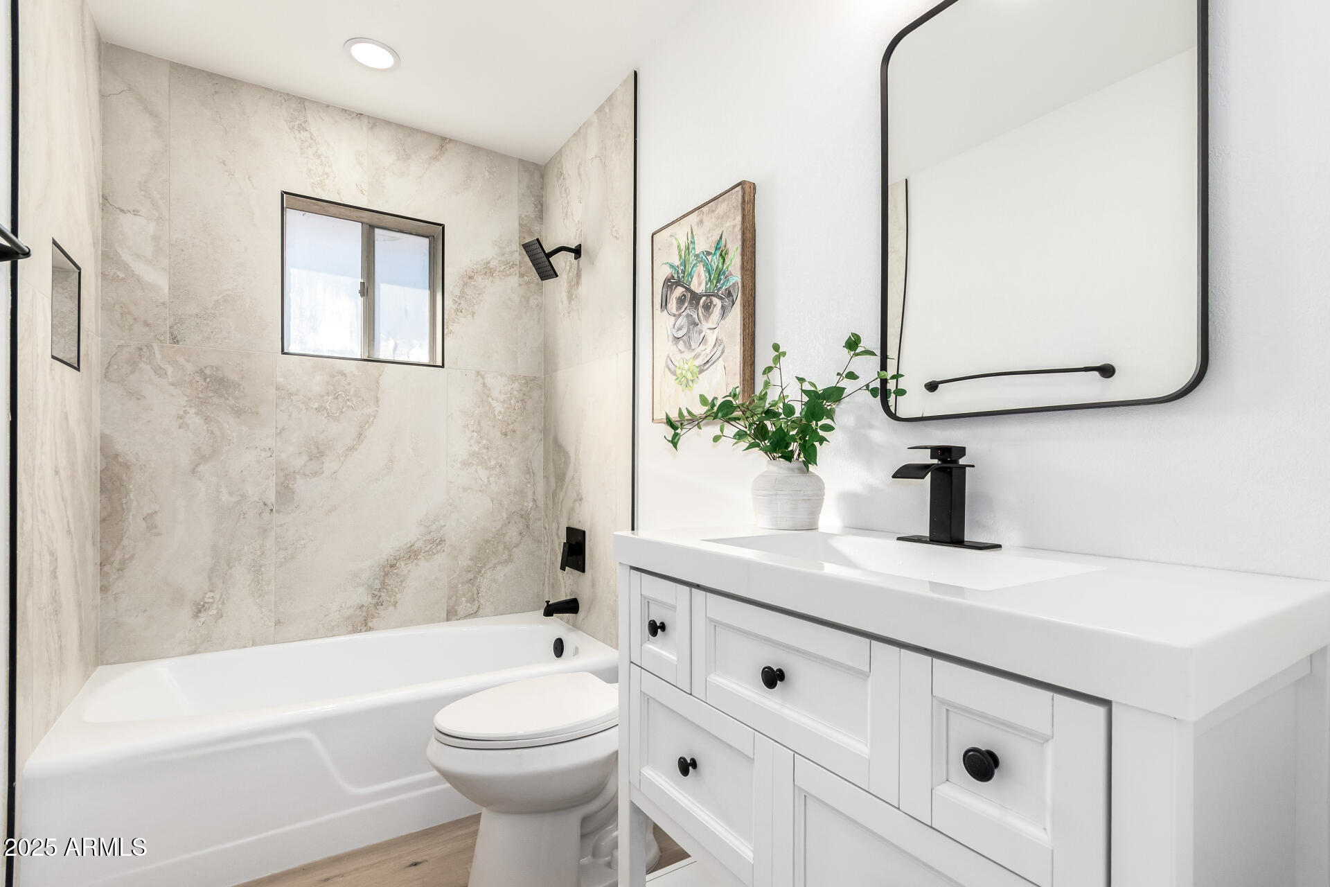 5237 East Dallas Street Mesa, AZ 85205 - Photo 18 of 30 a bathroom with a sink a toilet and a bathtub