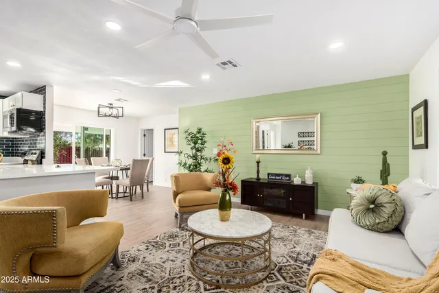 a bedroom with furniture and a large window