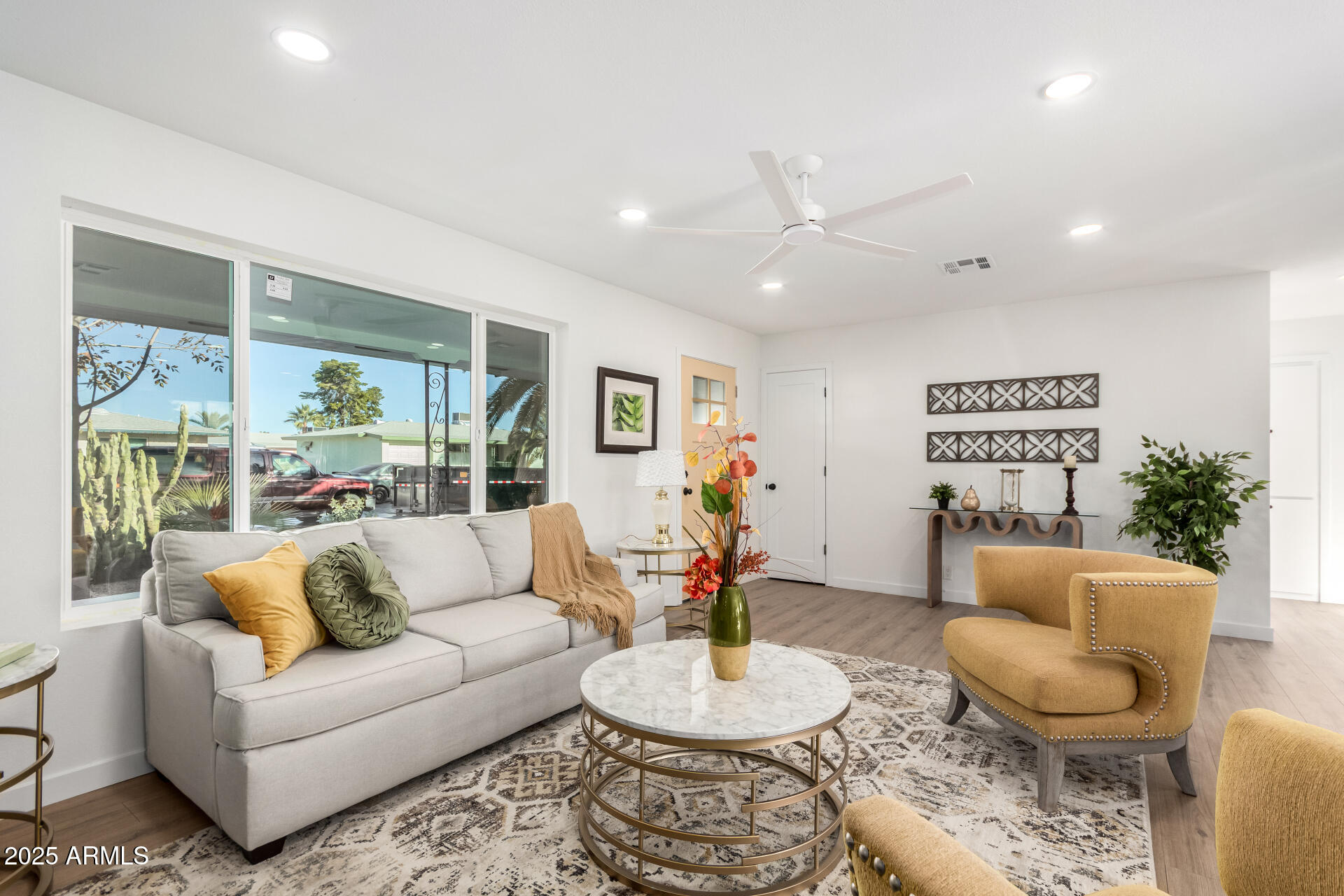 5237 East Dallas Street Mesa, AZ 85205 - Photo 6 of 30 a living room with furniture and a large window
