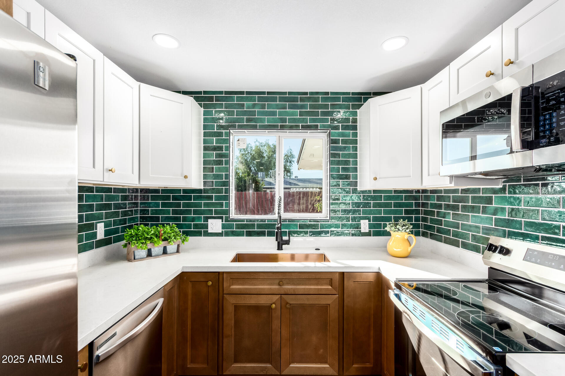 5237 East Dallas Street Mesa, AZ 85205 - Photo 10 of 30 a kitchen with a sink and a stove top oven