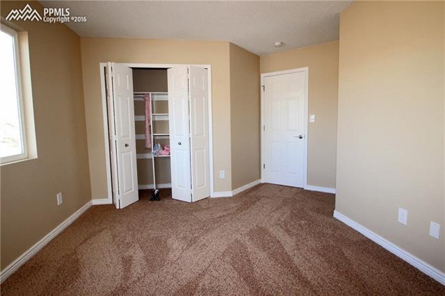 5224 Rondo Way Colorado Springs, CO 80911 - Photo 18 of 36 Upper second bedroom closet.