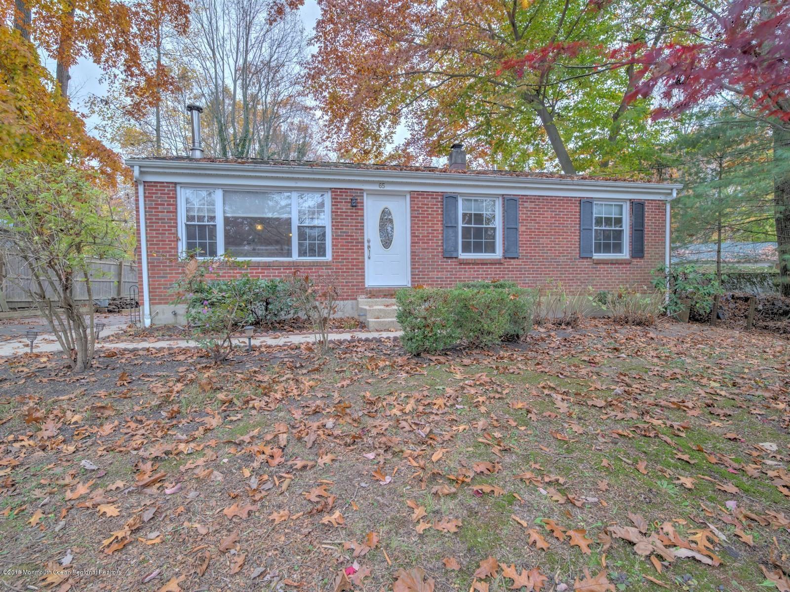 65 Streeker Road Wrightstown, NJ 08562 - Photo 1 of 34 front view of a house with a yard
