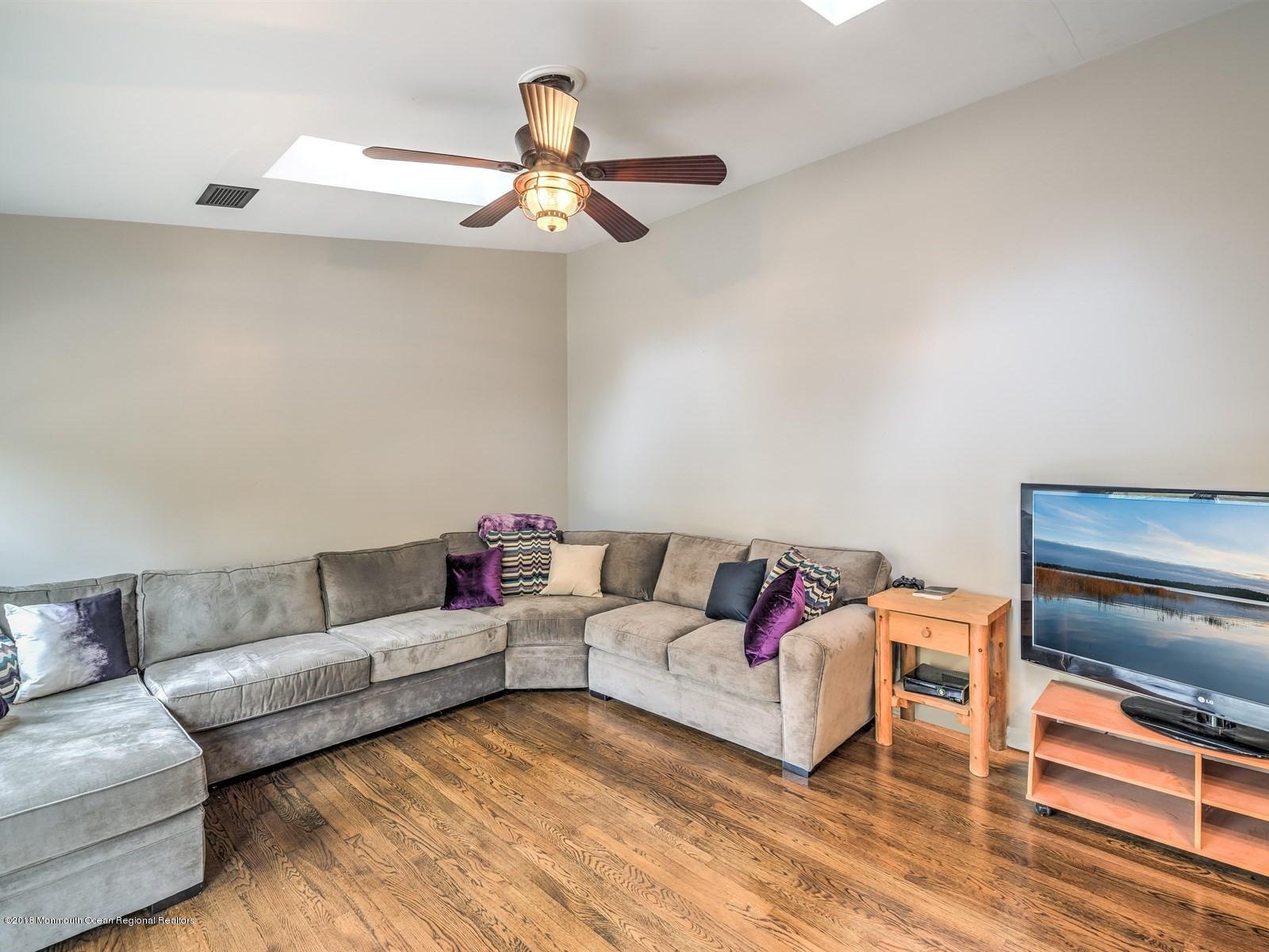 65 Streeker Road Wrightstown, NJ 08562 - Photo 13 of 34 a living room with furniture and a couch