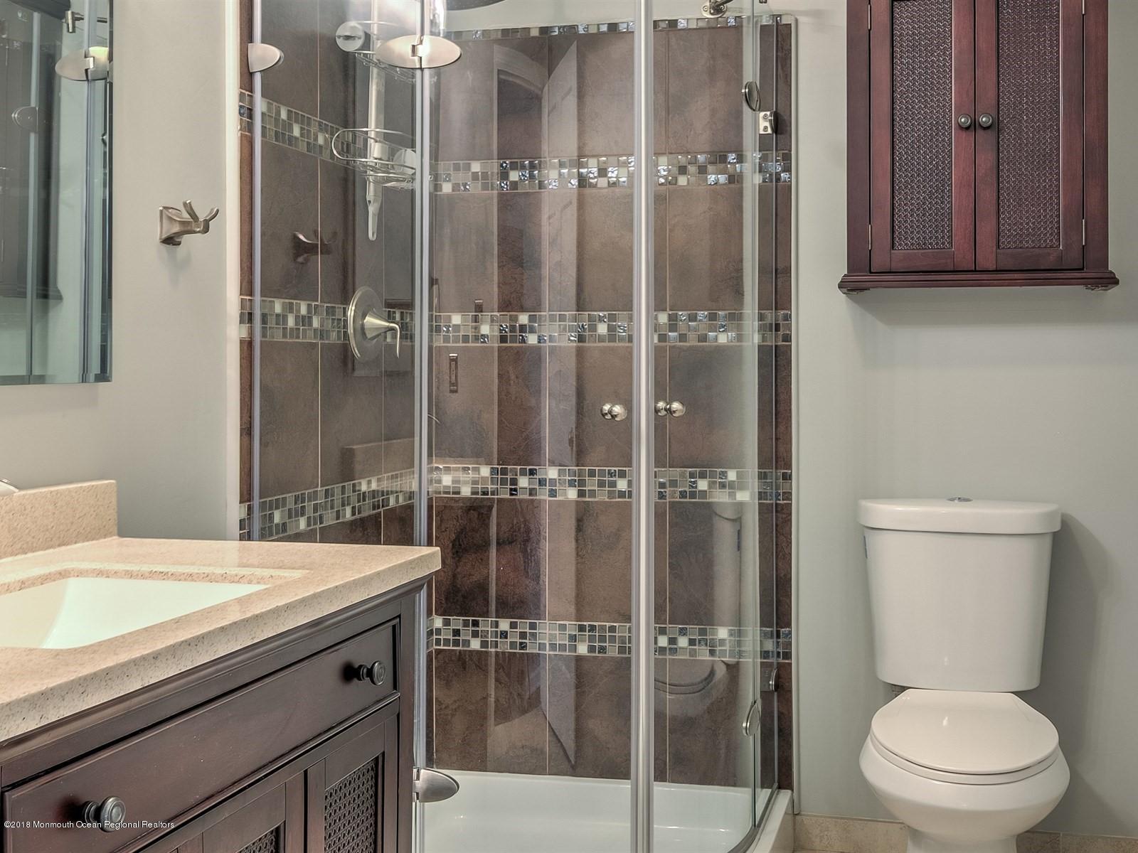 65 Streeker Road Wrightstown, NJ 08562 - Photo 14 of 34 a bathroom with a shower a toilet and a sink