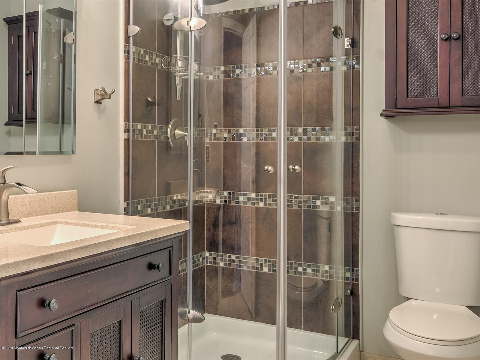 65 Streeker Road Wrightstown, NJ 08562 - Photo 15 of 34 a bathroom with a sink a toilet and shower