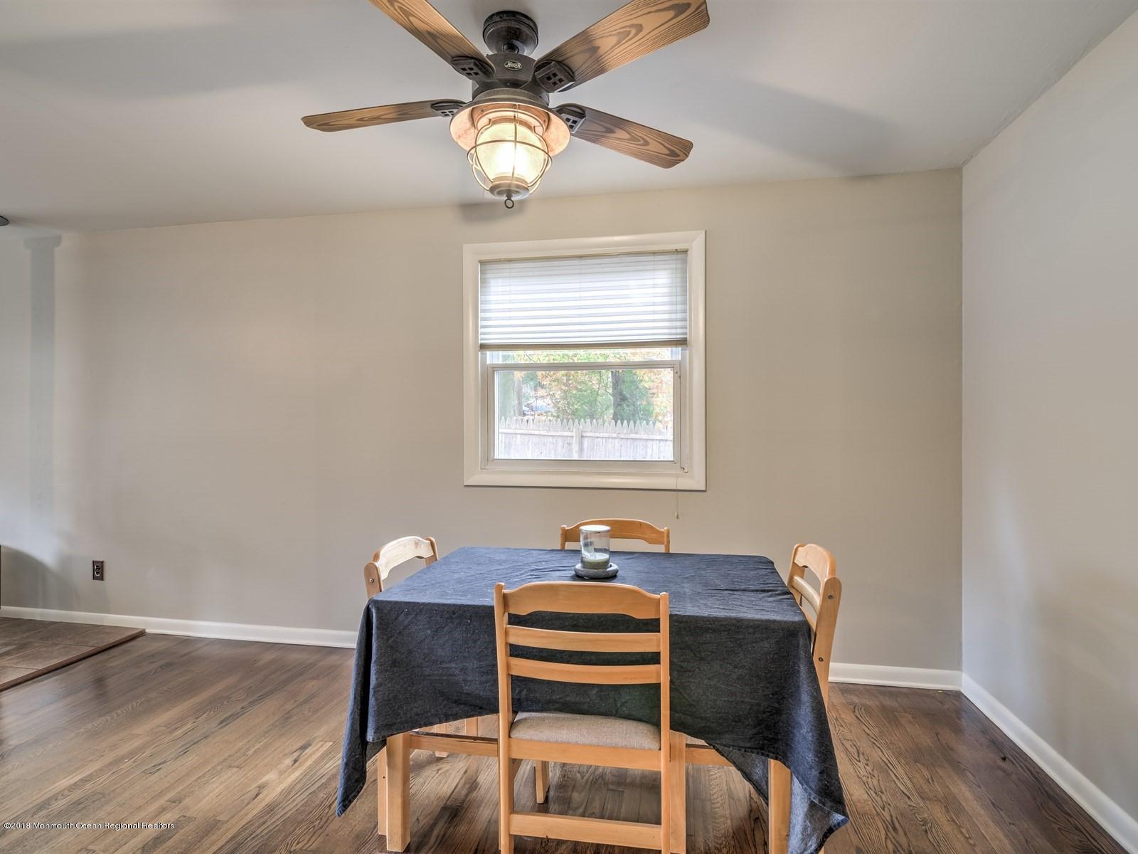 65 Streeker Road Wrightstown, NJ 08562 - Photo 17 of 34 a dining room with a table chairs and wooden floor