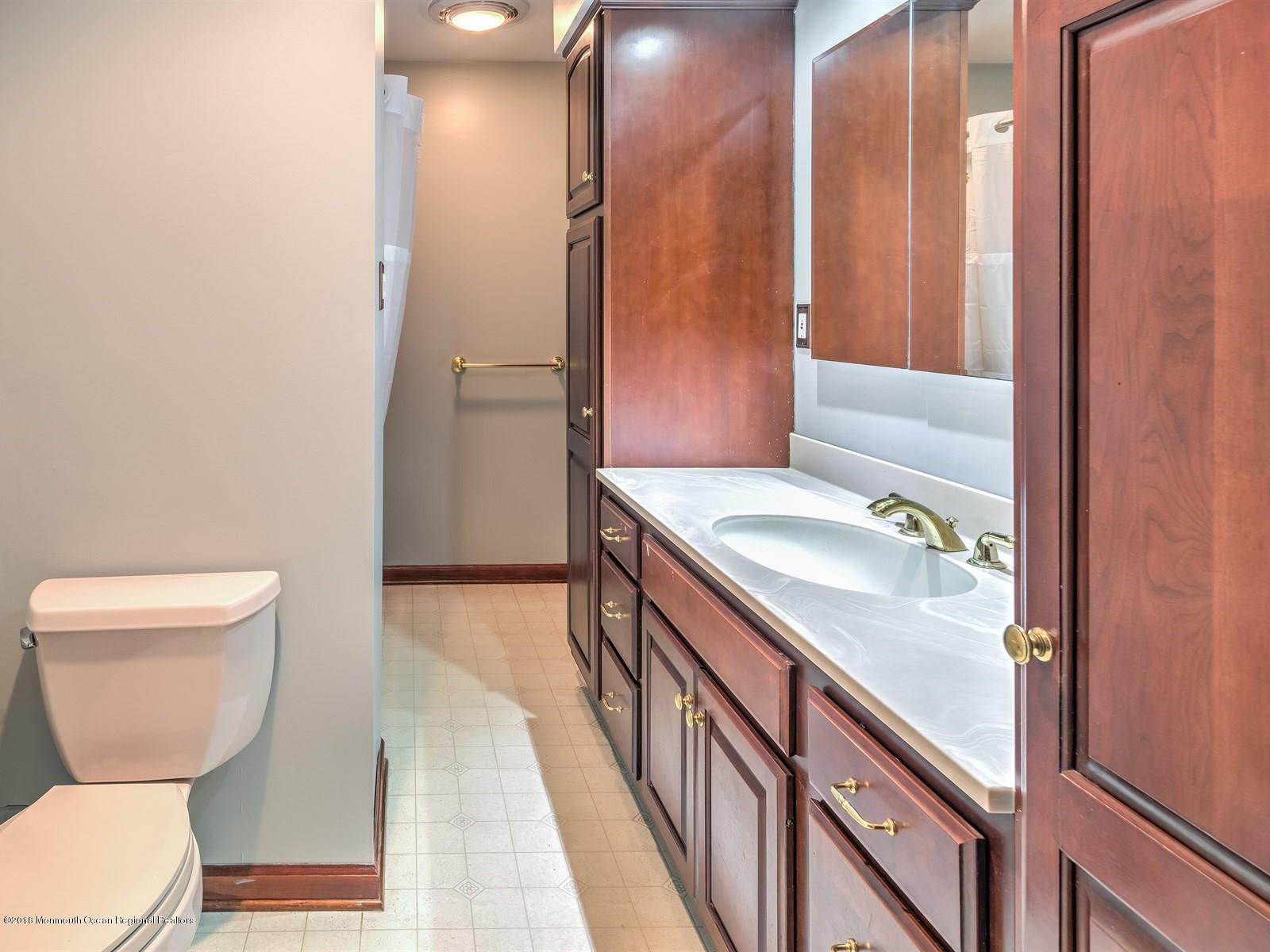 65 Streeker Road Wrightstown, NJ 08562 - Photo 20 of 34 a bathroom with a sink toilet and shower