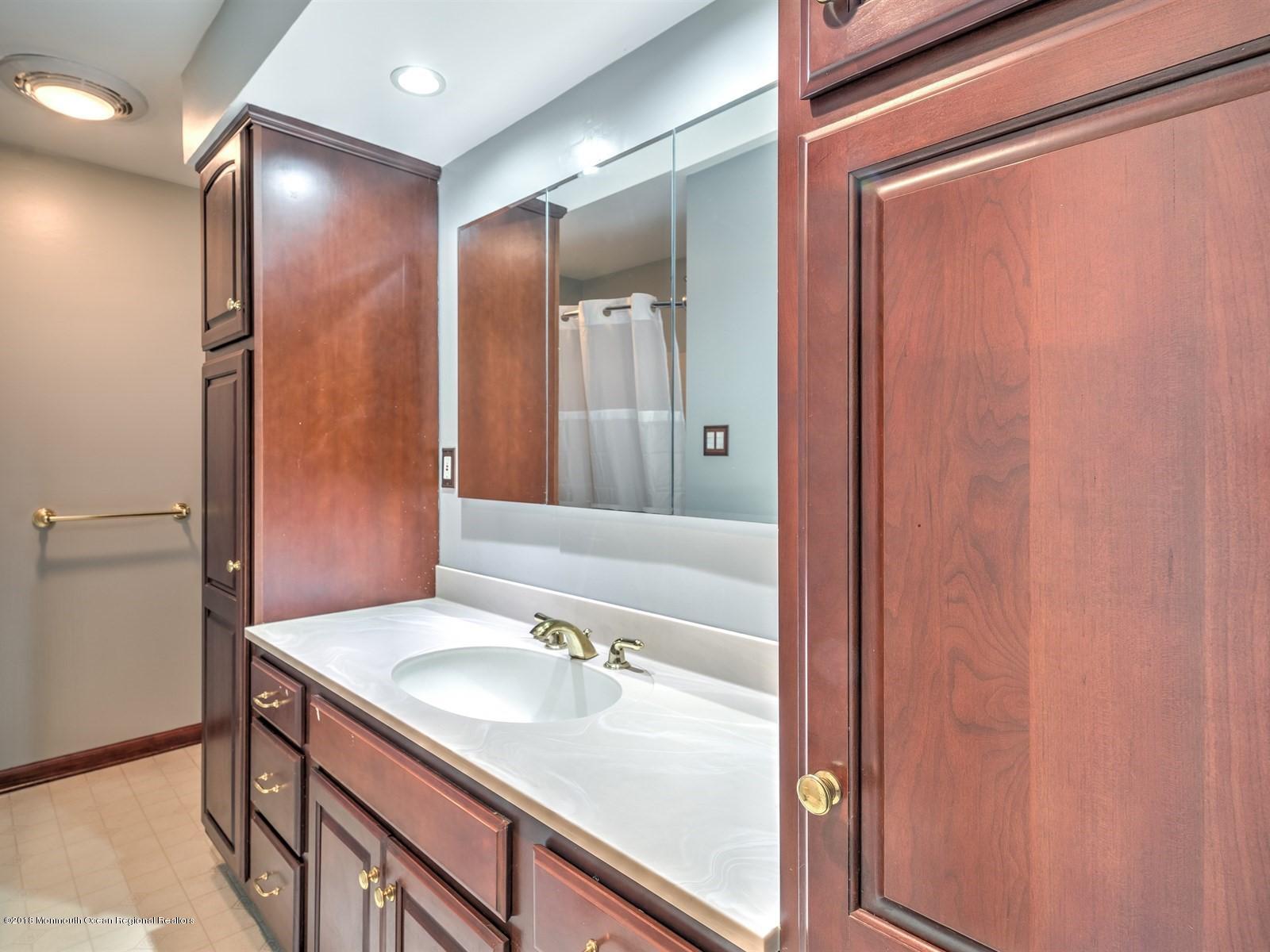 65 Streeker Road Wrightstown, NJ 08562 - Photo 21 of 34 a bathroom with a sink and a mirror