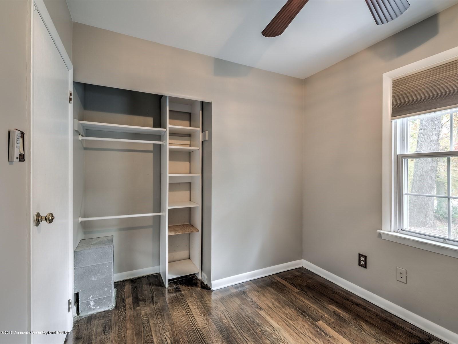 65 Streeker Road Wrightstown, NJ 08562 - Photo 24 of 34 a view of an empty room with wooden floor and a window