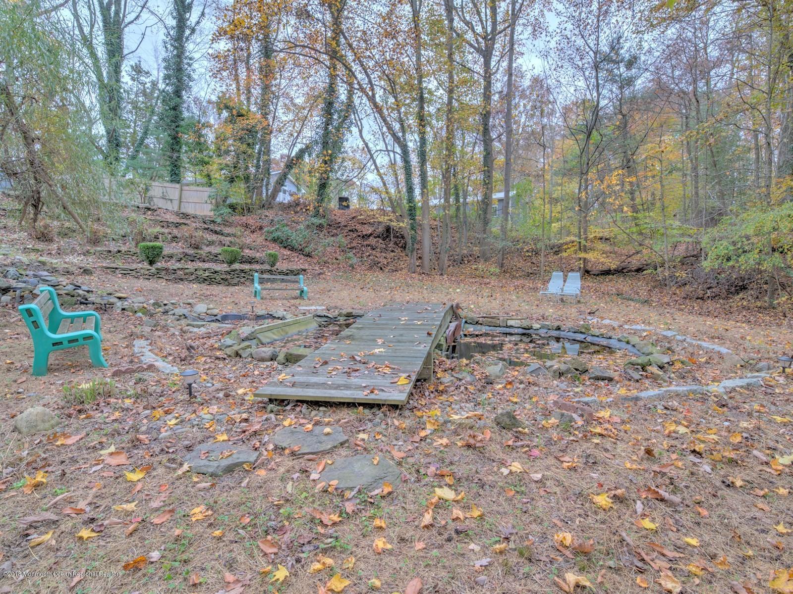 65 Streeker Road Wrightstown, NJ 08562 - Photo 27 of 34 a view of a yard with plants and trees