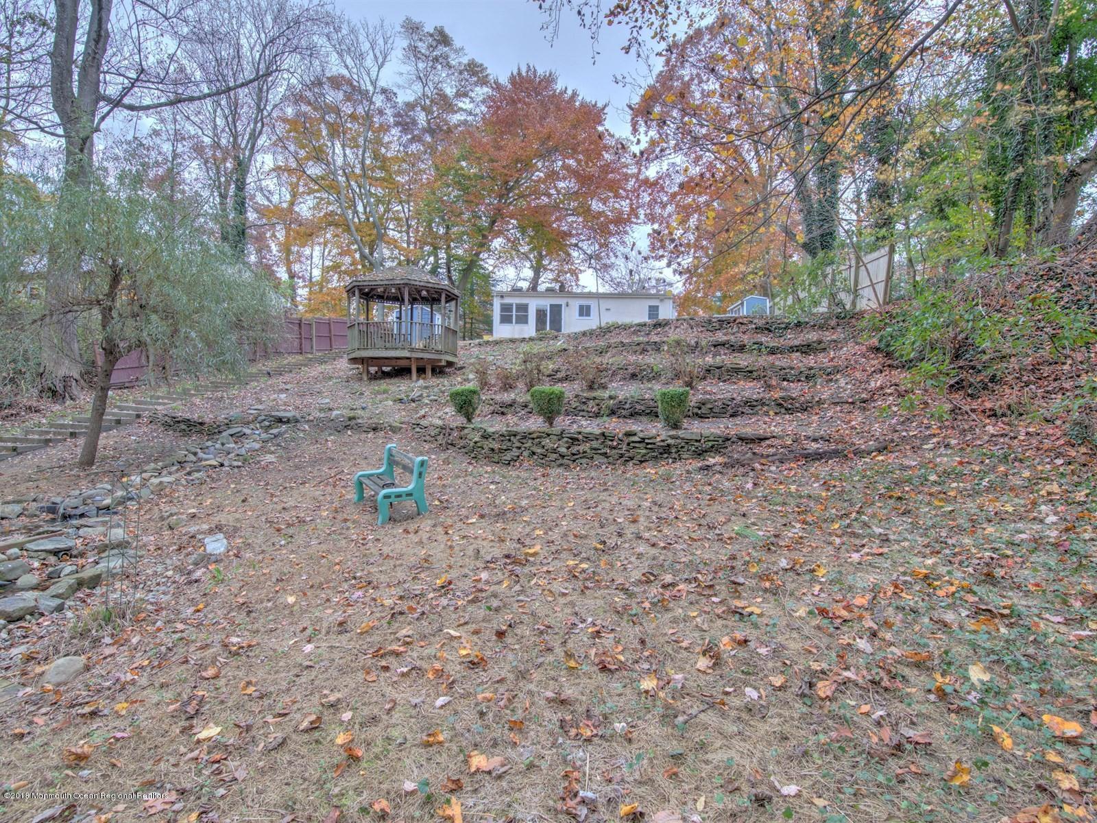 65 Streeker Road Wrightstown, NJ 08562 - Photo 30 of 34 a backyard of a house with lots of green space