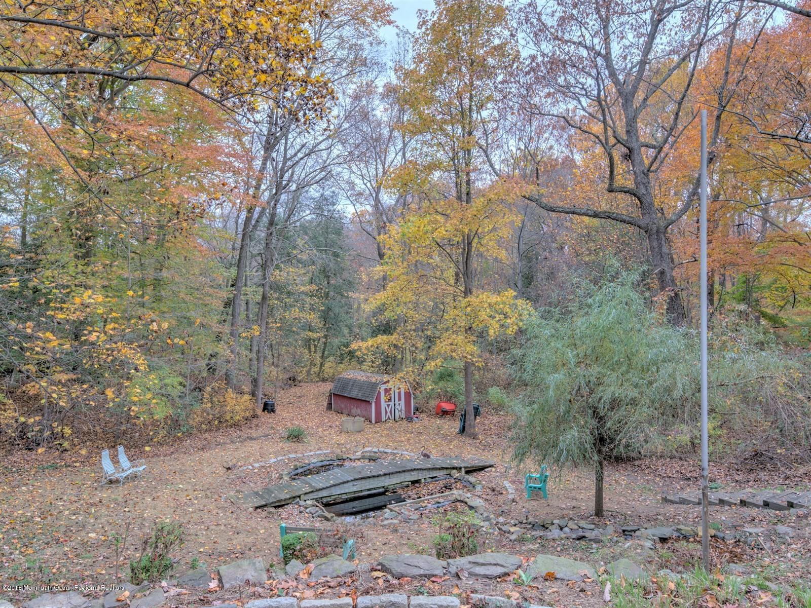 65 Streeker Road Wrightstown, NJ 08562 - Photo 31 of 34 a backyard of a house with lots of green space