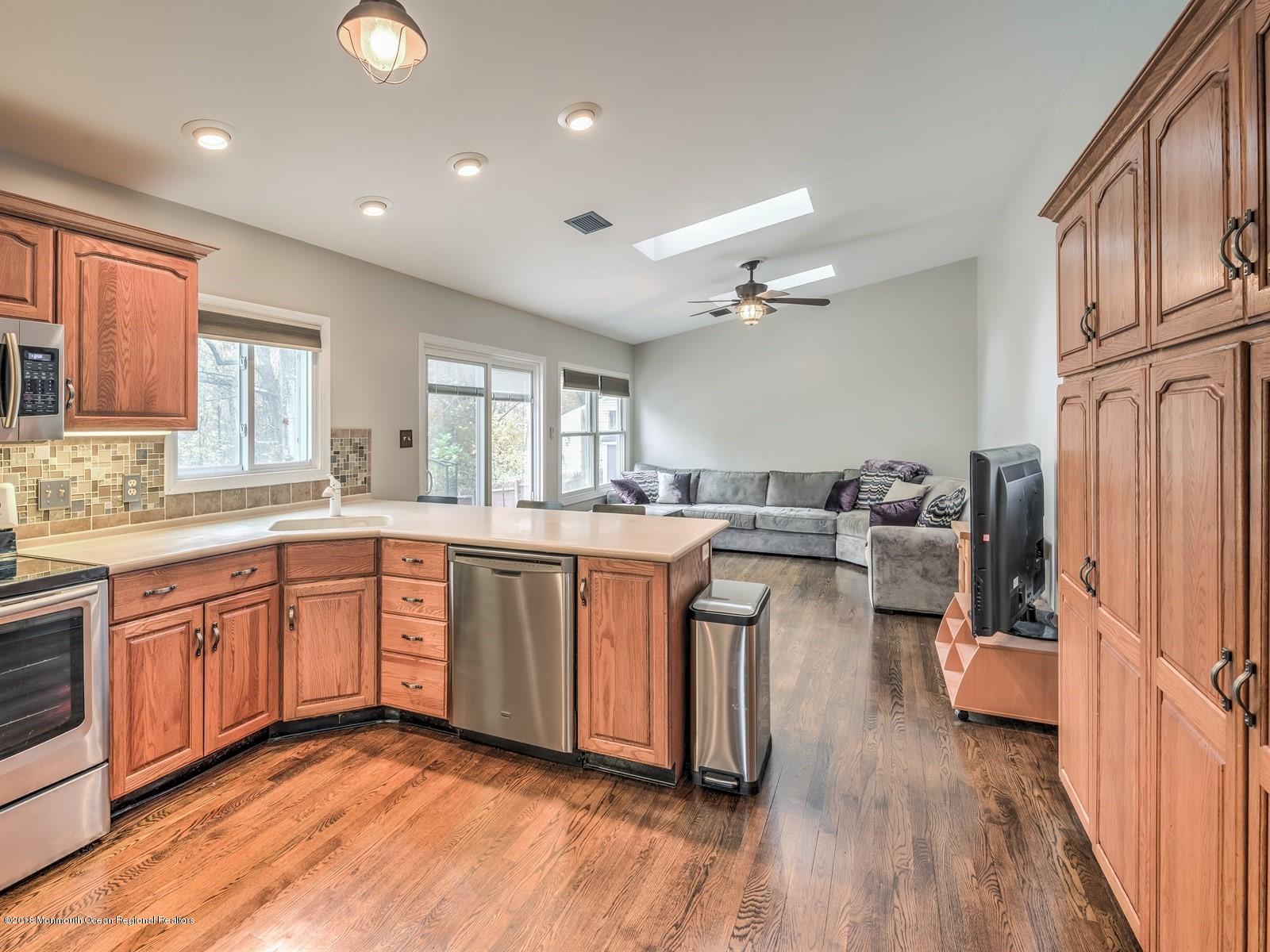 65 Streeker Road Wrightstown, NJ 08562 - Photo 4 of 34 a kitchen with sink cabinets and wooden floor