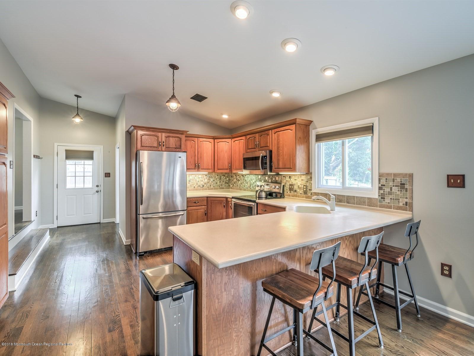 65 Streeker Road Wrightstown, NJ 08562 - Photo 10 of 34 a large kitchen with a table and chairs
