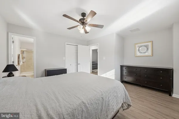 a bedroom with a bed and a dresser