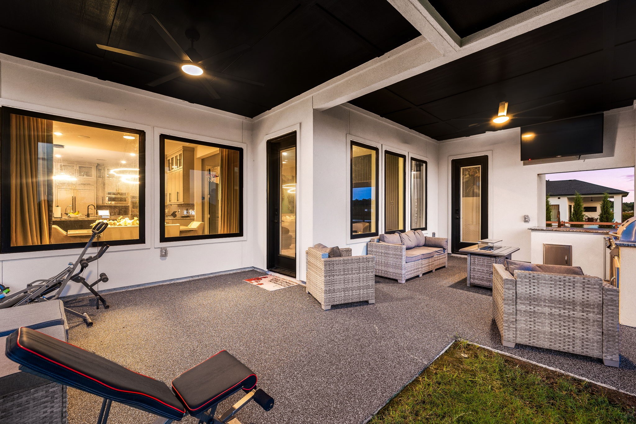 29419 Cir S Rnch Trail Fulshear, TX 77406 - Photo 33 of 45 Looking from the opposite angle, the refined patio layout offers extensive space for outdoor seating arrangements with premium tile flooring and clear views across the lawn.