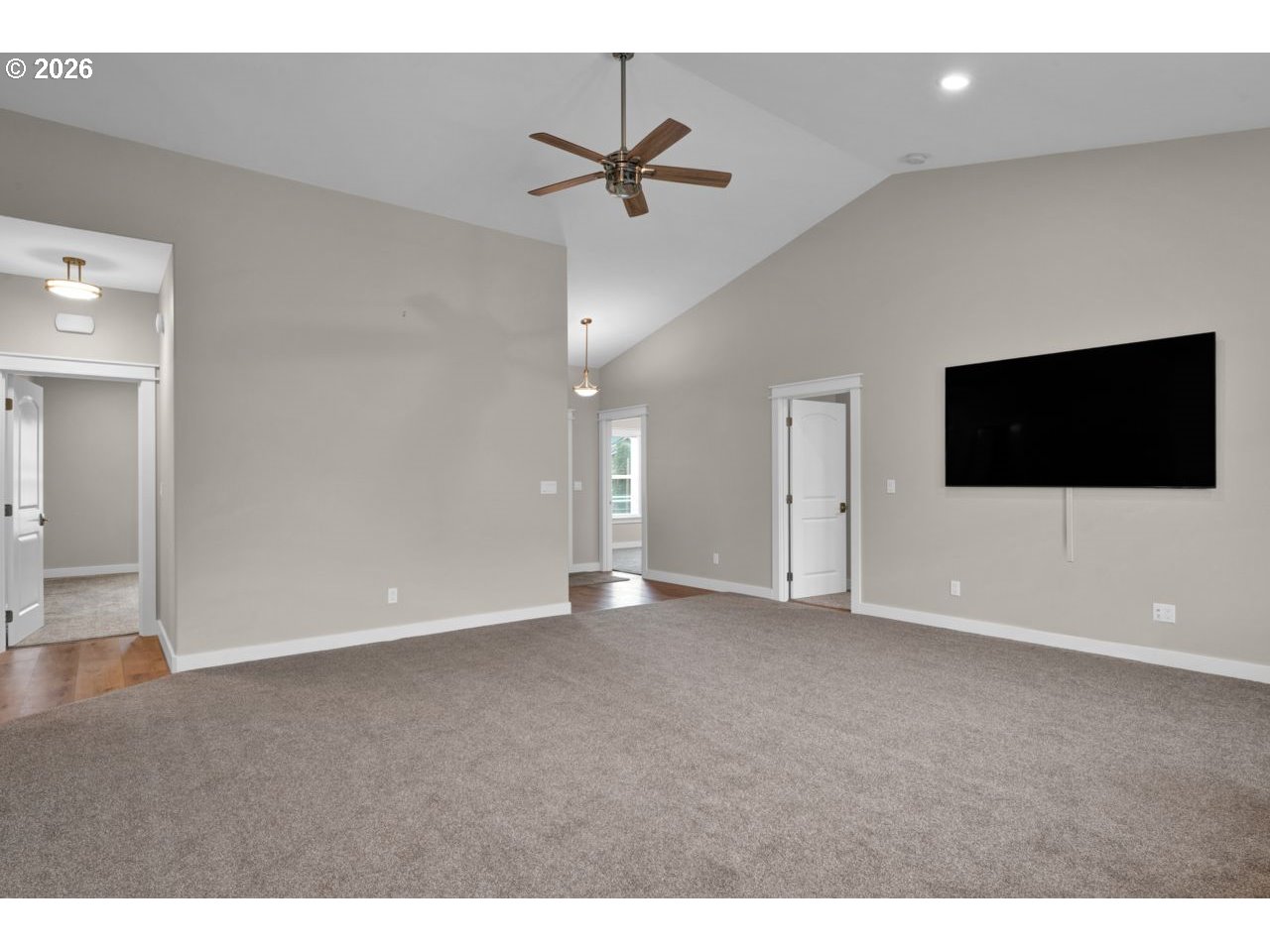 4080 Caddington Lane Florence, OR 97439 - Photo 11 of 48 a view of an empty room with a flat screen tv