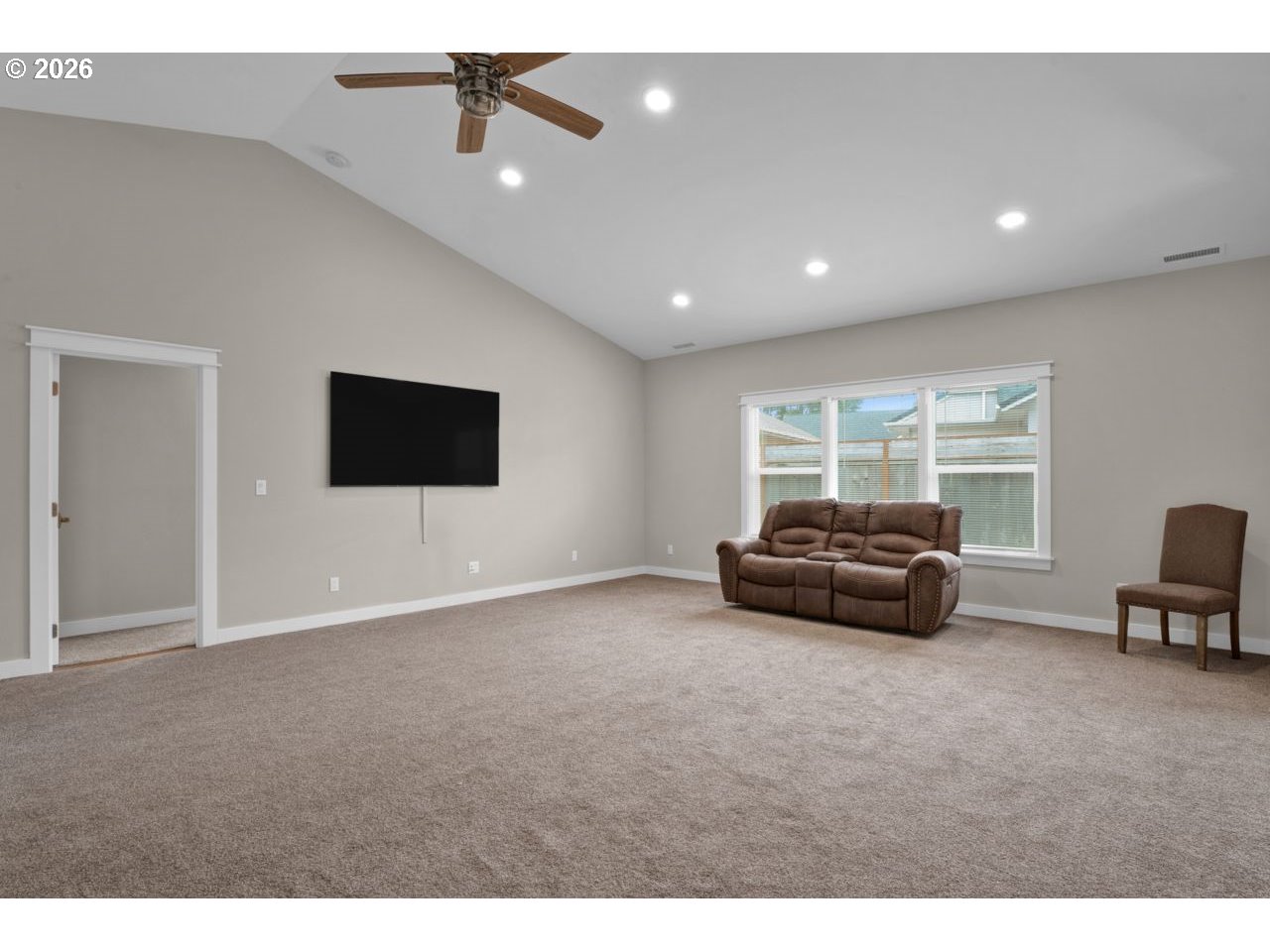 4080 Caddington Lane Florence, OR 97439 - Photo 12 of 48 a living room with furniture and a flat screen tv