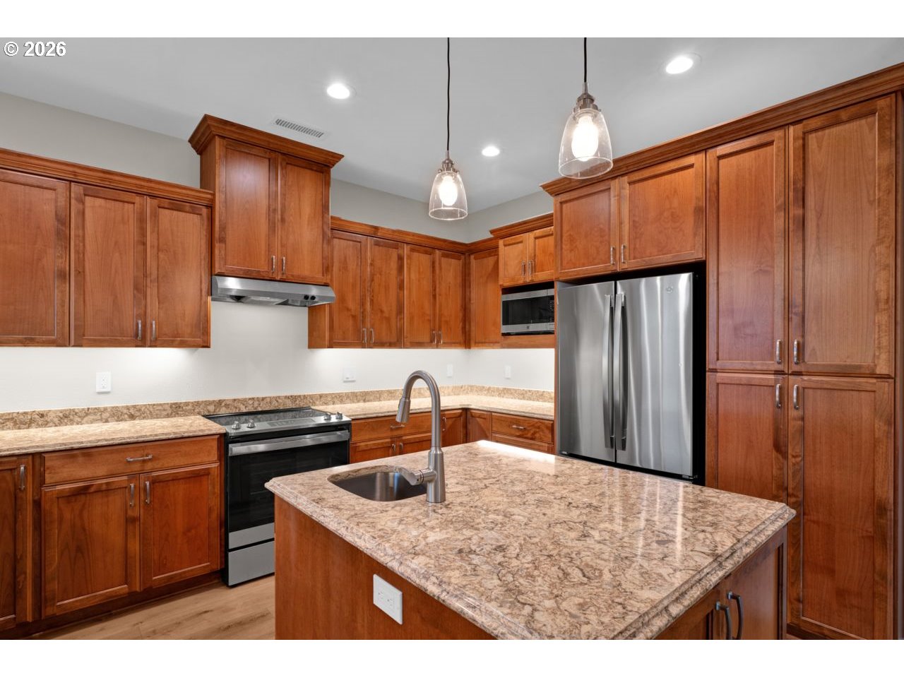 4080 Caddington Lane Florence, OR 97439 - Photo 17 of 48 a kitchen with stainless steel appliances granite countertop a sink refrigerator and cabinets
