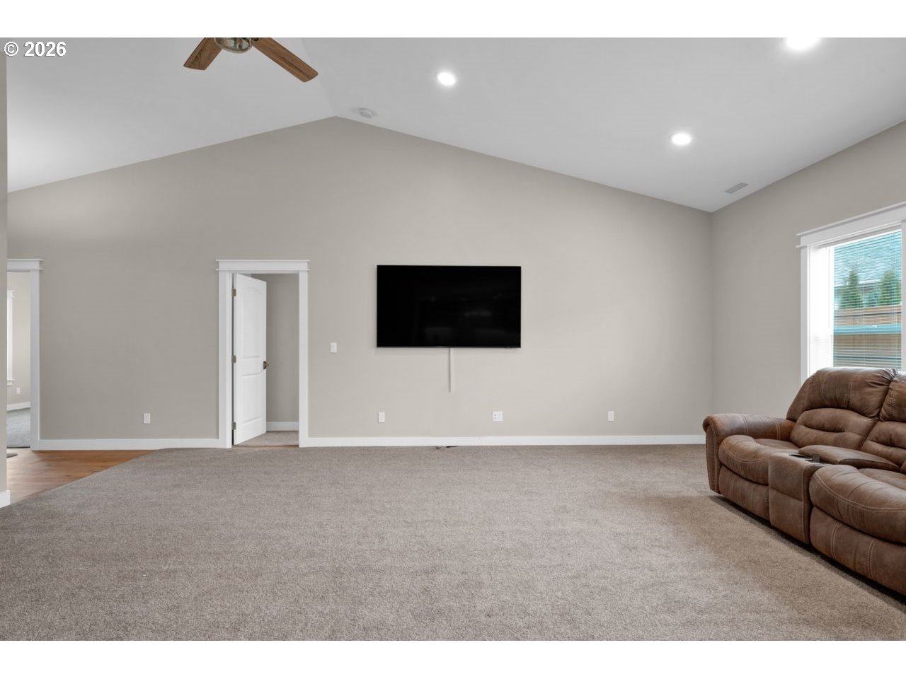 4080 Caddington Lane Florence, OR 97439 - Photo 21 of 48 a living room with furniture and a flat screen tv