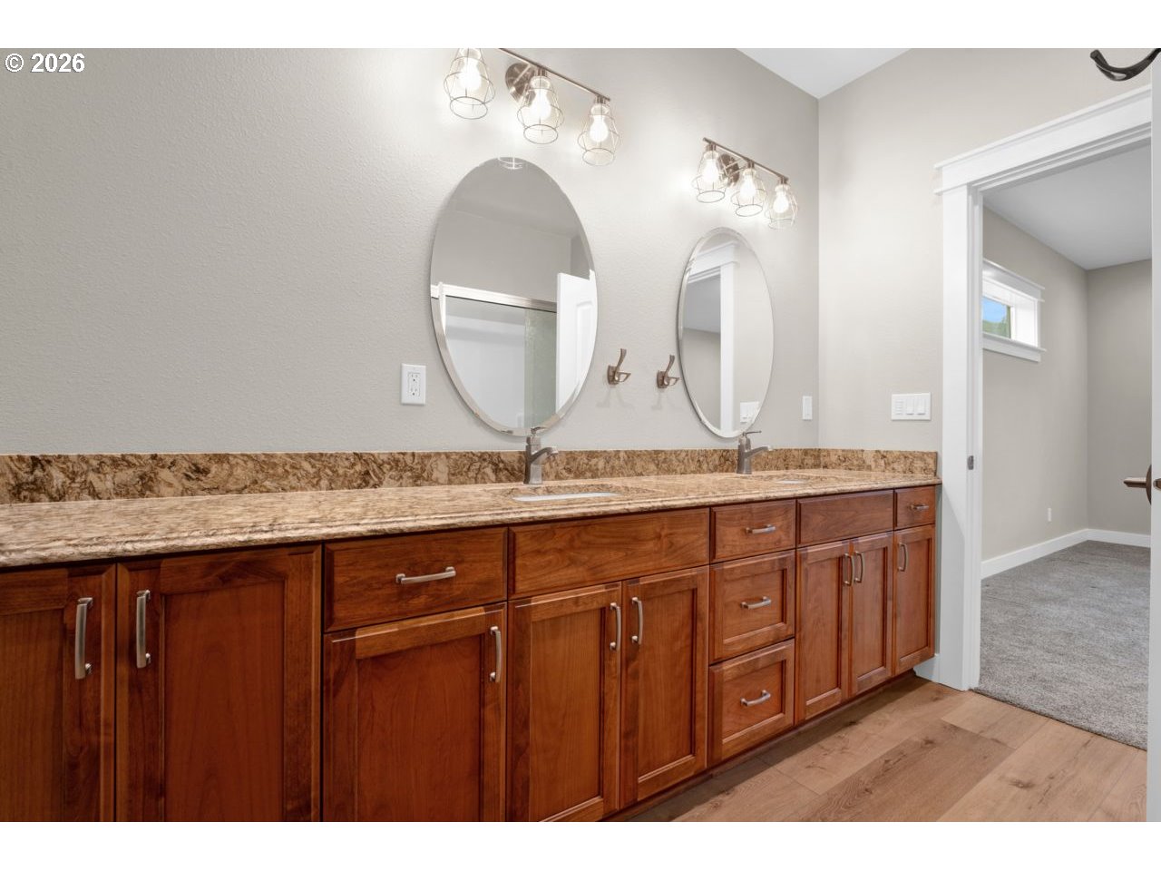 4080 Caddington Lane Florence, OR 97439 - Photo 26 of 48 a bathroom with a granite countertop double vanity sink and a mirror