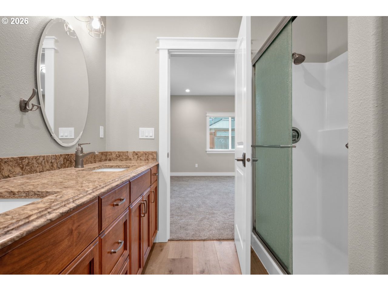 4080 Caddington Lane Florence, OR 97439 - Photo 27 of 48 a bathroom with a granite countertop sink and a mirror