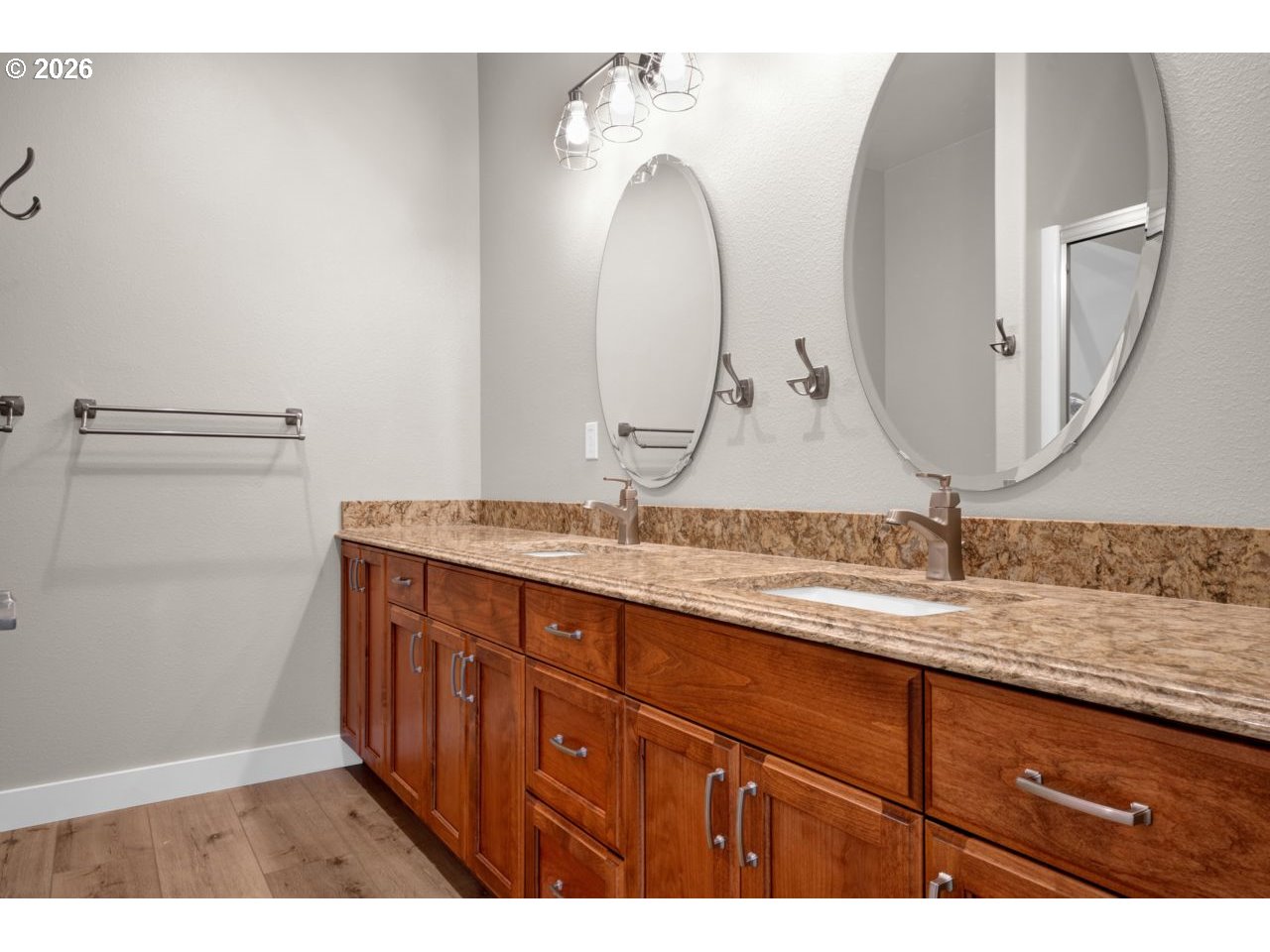 4080 Caddington Lane Florence, OR 97439 - Photo 28 of 48 a bathroom with a double vanity sink and a mirror