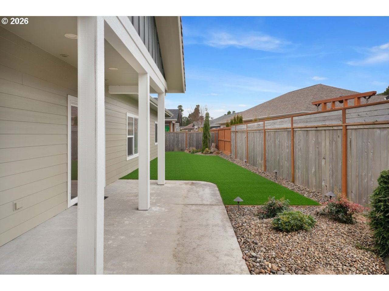 4080 Caddington Lane Florence, OR 97439 - Photo 42 of 48 a view of a backyard with potted plants