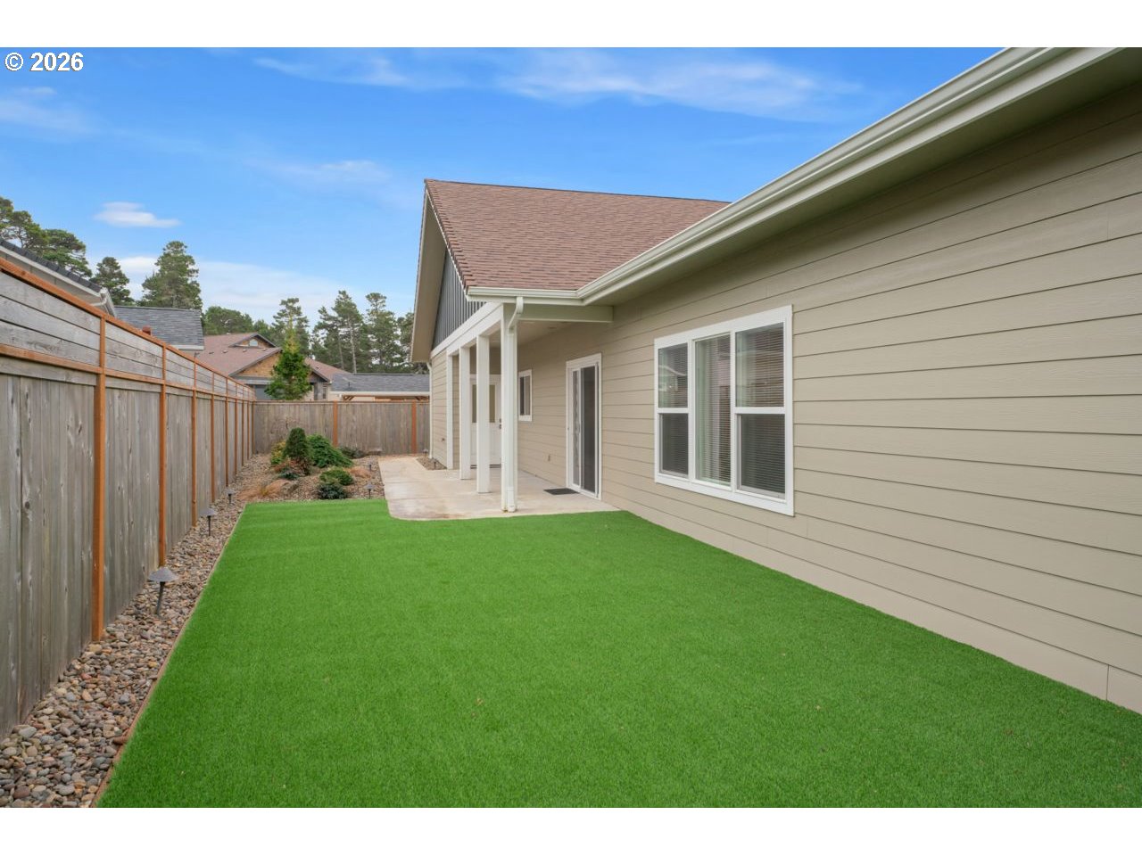 4080 Caddington Lane Florence, OR 97439 - Photo 43 of 48 a view of backyard with barbeque grill and wooden fence