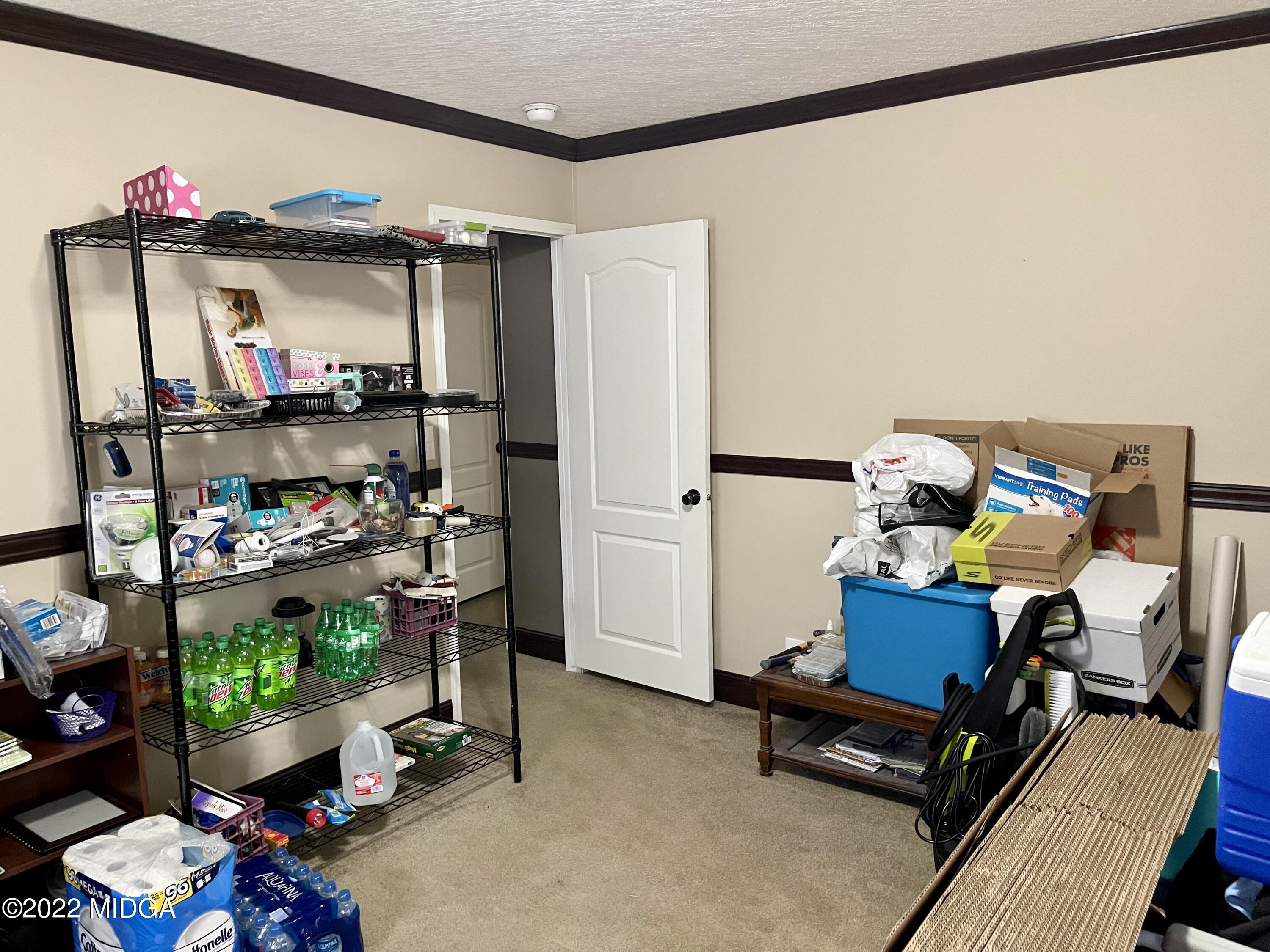 9532 Old Gordon Road Dry Branch, GA 31020 - Photo 18 of 29 a room with storage and utility
