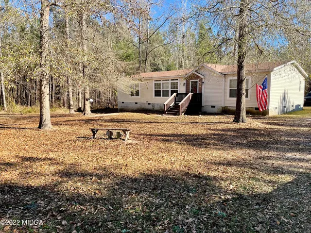 a view of a town with large trees