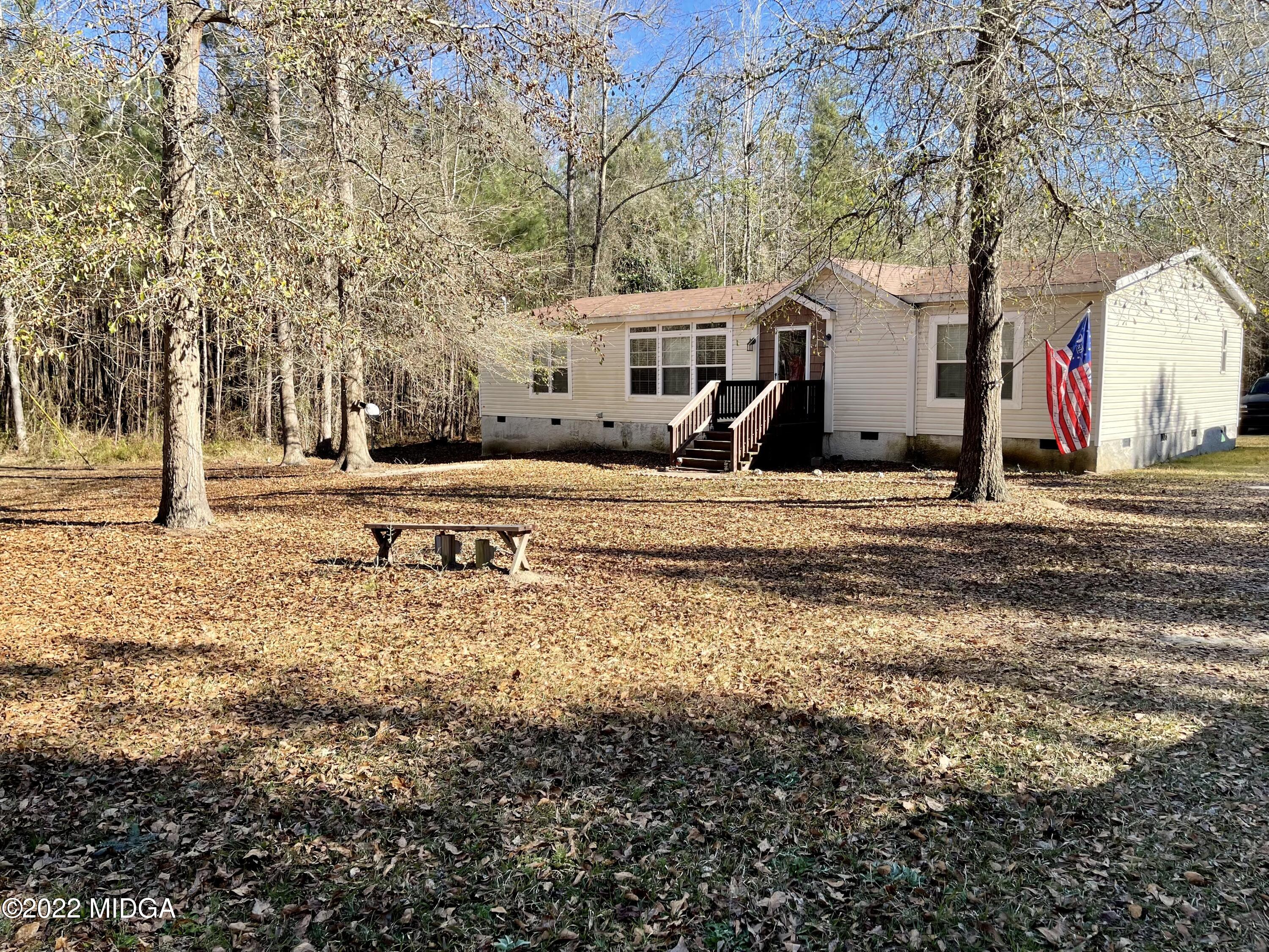 9532 Old Gordon Road Dry Branch, GA 31020 - Photo 20 of 29 a view of a town with large trees