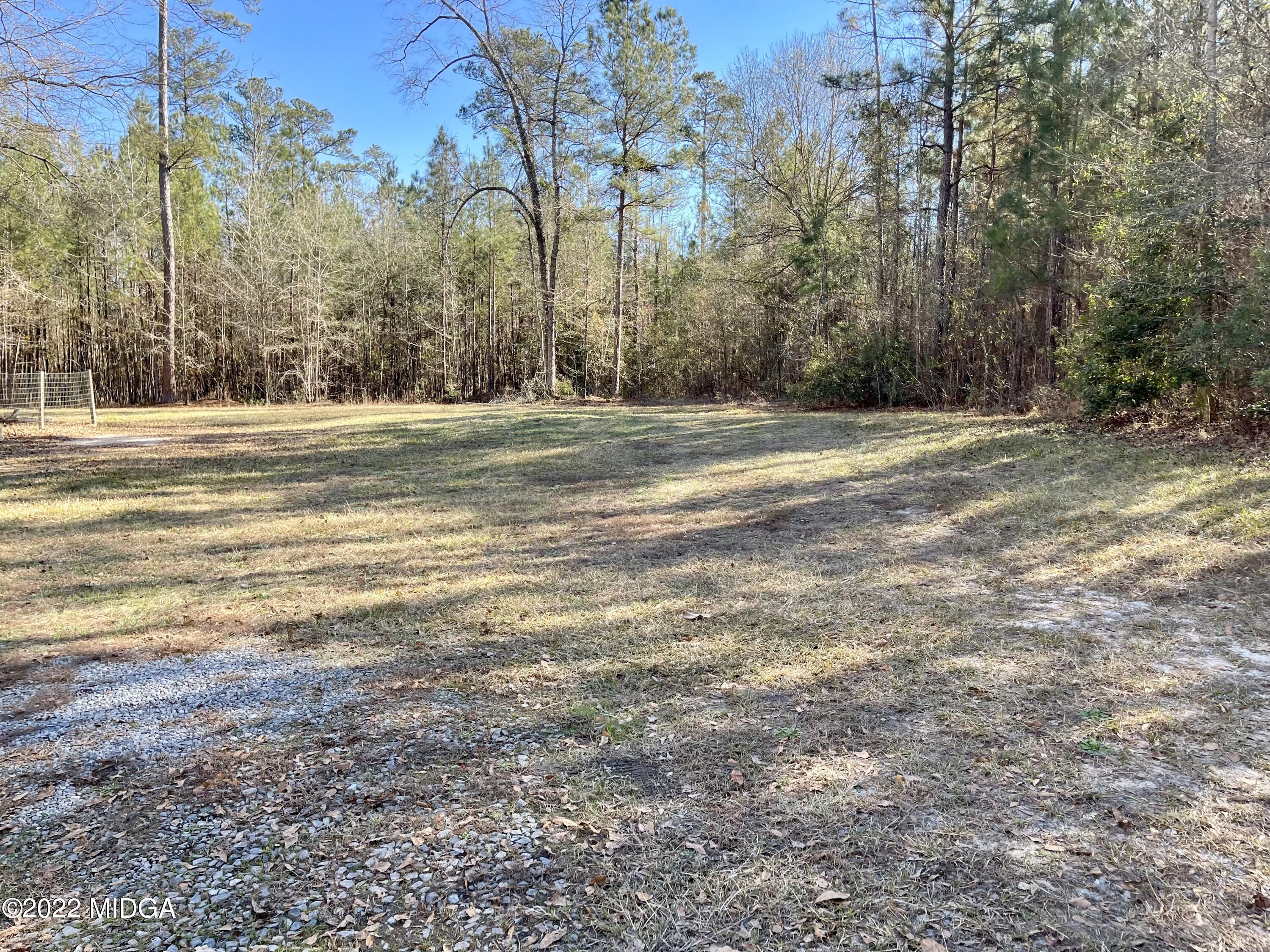 9532 Old Gordon Road Dry Branch, GA 31020 - Photo 24 of 29 a view of large trees with a house