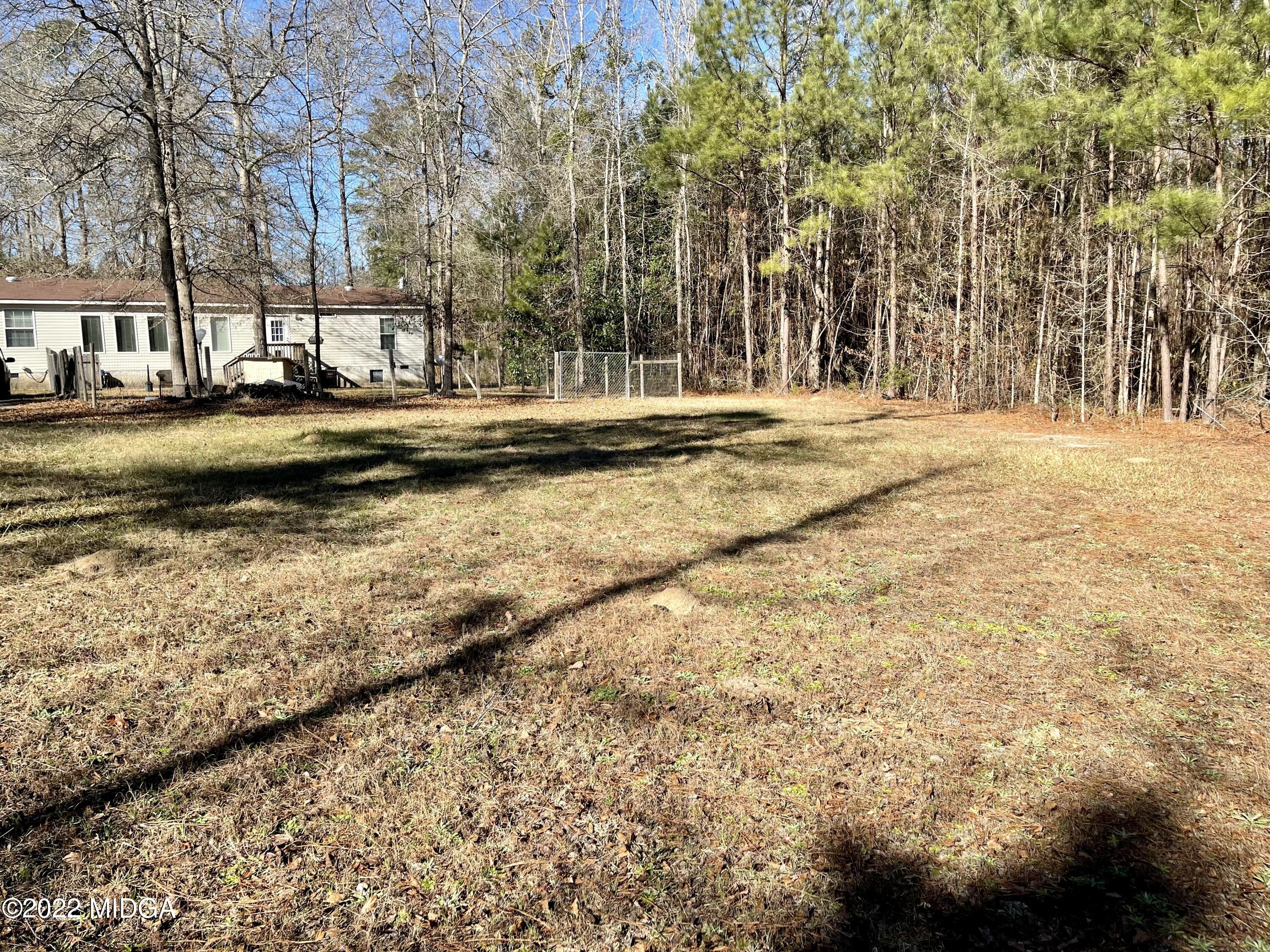 9532 Old Gordon Road Dry Branch, GA 31020 - Photo 27 of 29 a view of large building with large trees