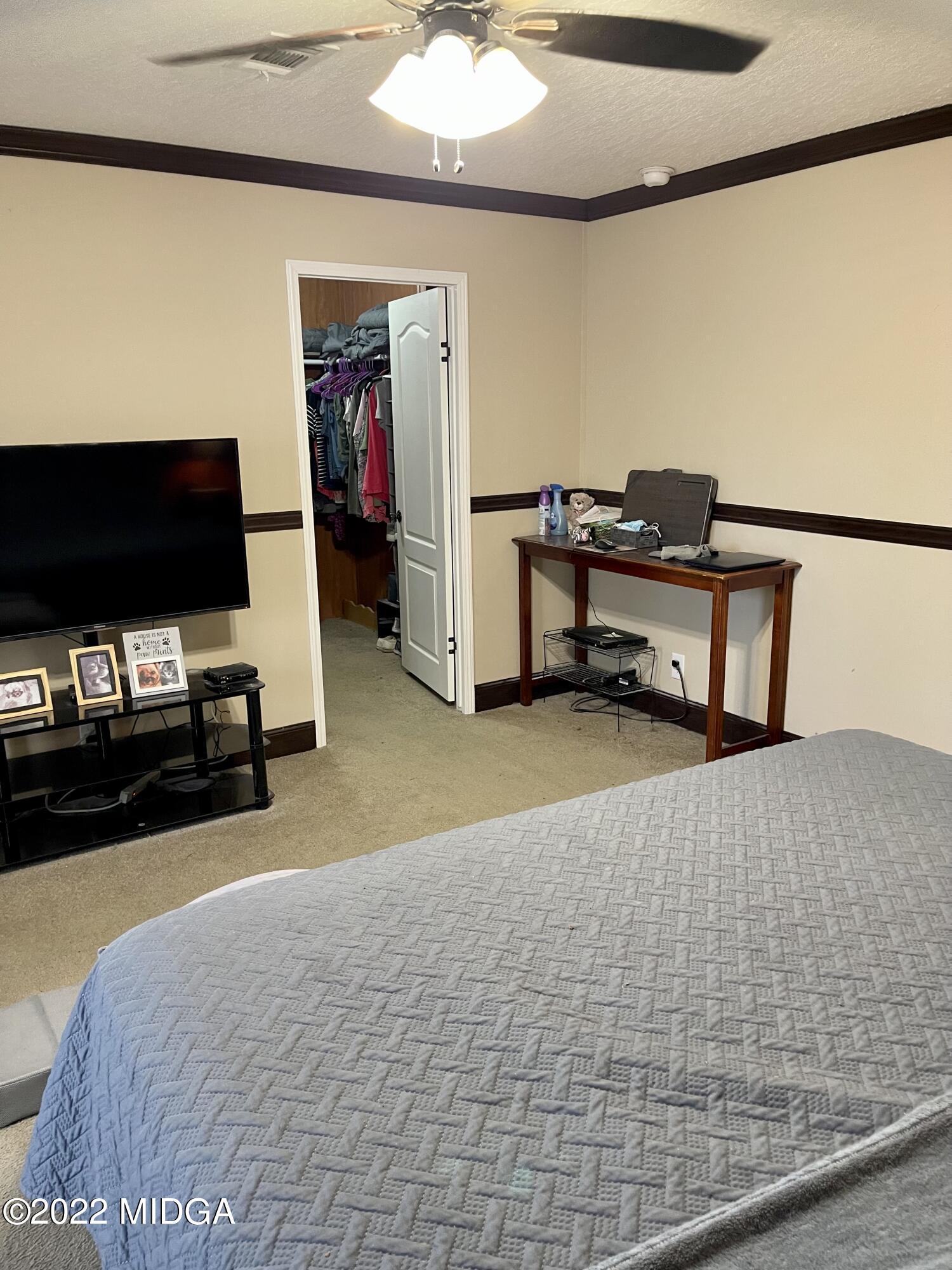 9532 Old Gordon Road Dry Branch, GA 31020 - Photo 7 of 29 a living room with furniture and a flat screen tv