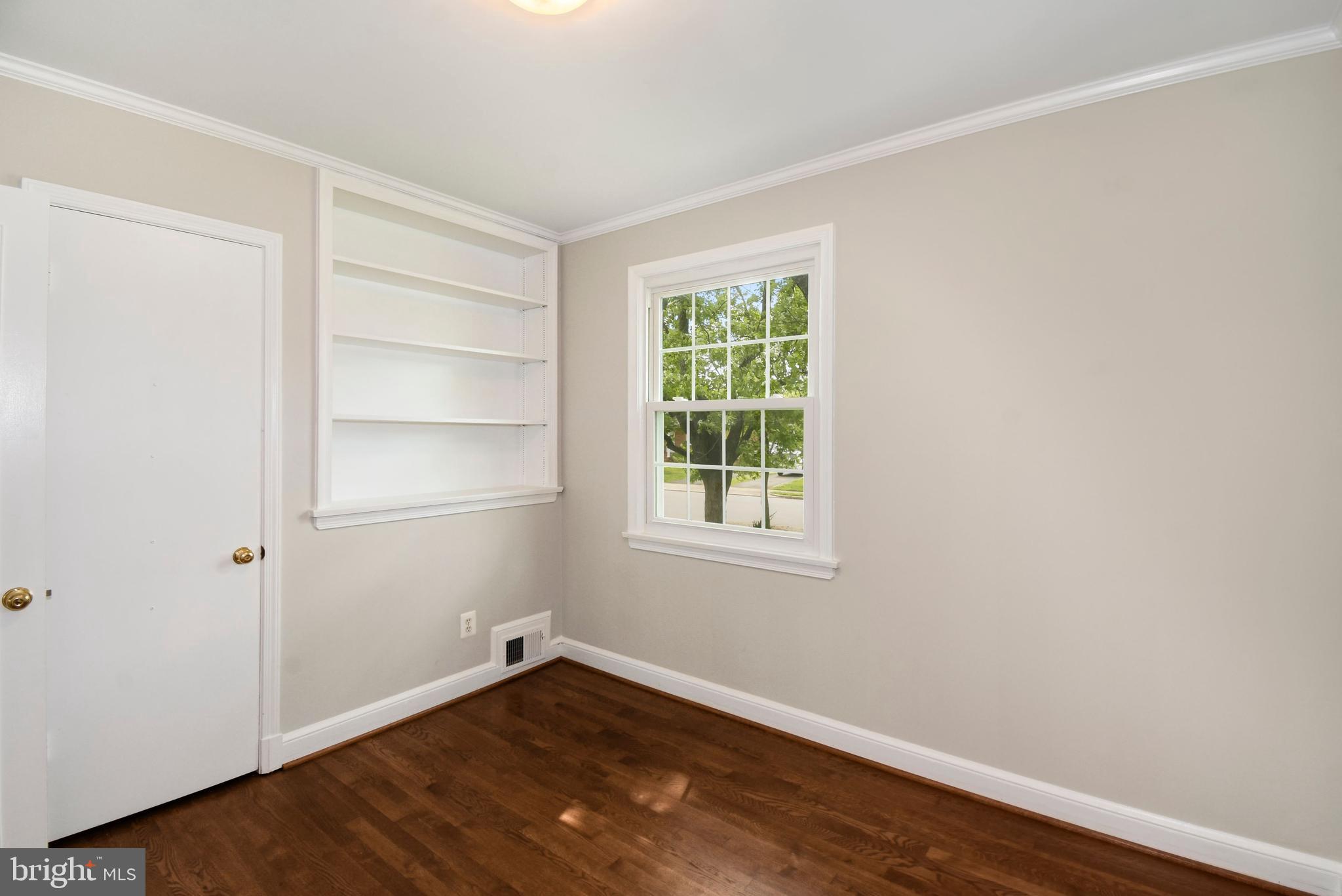 6105 Brandon Avenue Springfield, VA 22150 - Photo 18 of 45 Third bedroom built-in storage shelf and closet