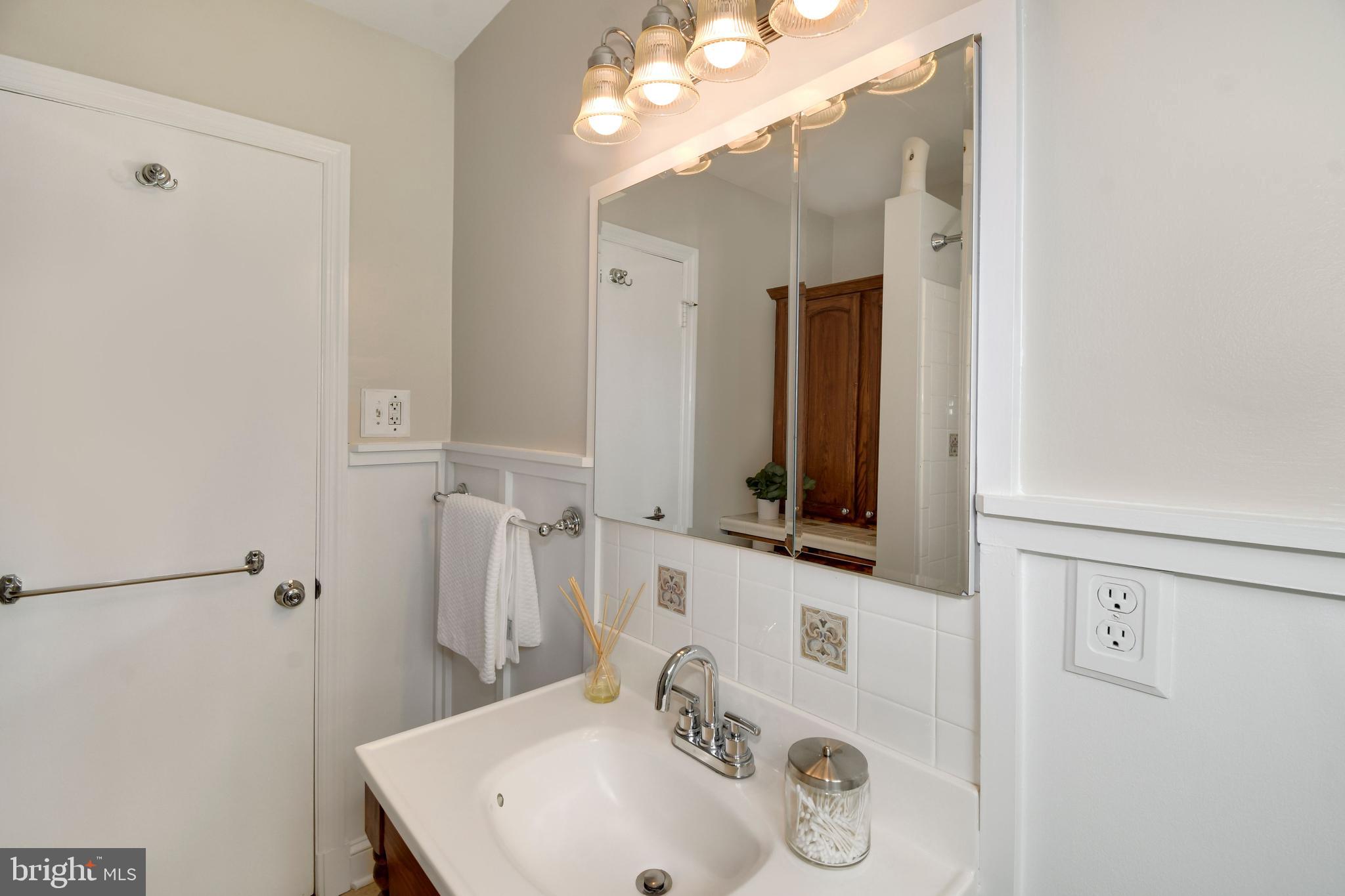 6105 Brandon Avenue Springfield, VA 22150 - Photo 22 of 45 Wainscoting, decorative light fixture