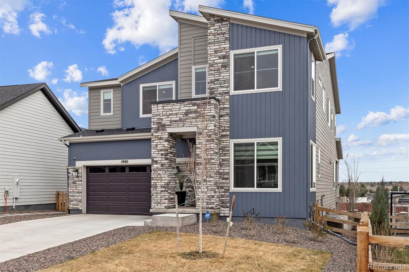 5980 South Platte Canyon Road Littleton, CO 80123 - Photo 1 of 50 a front view of a house with a garage
