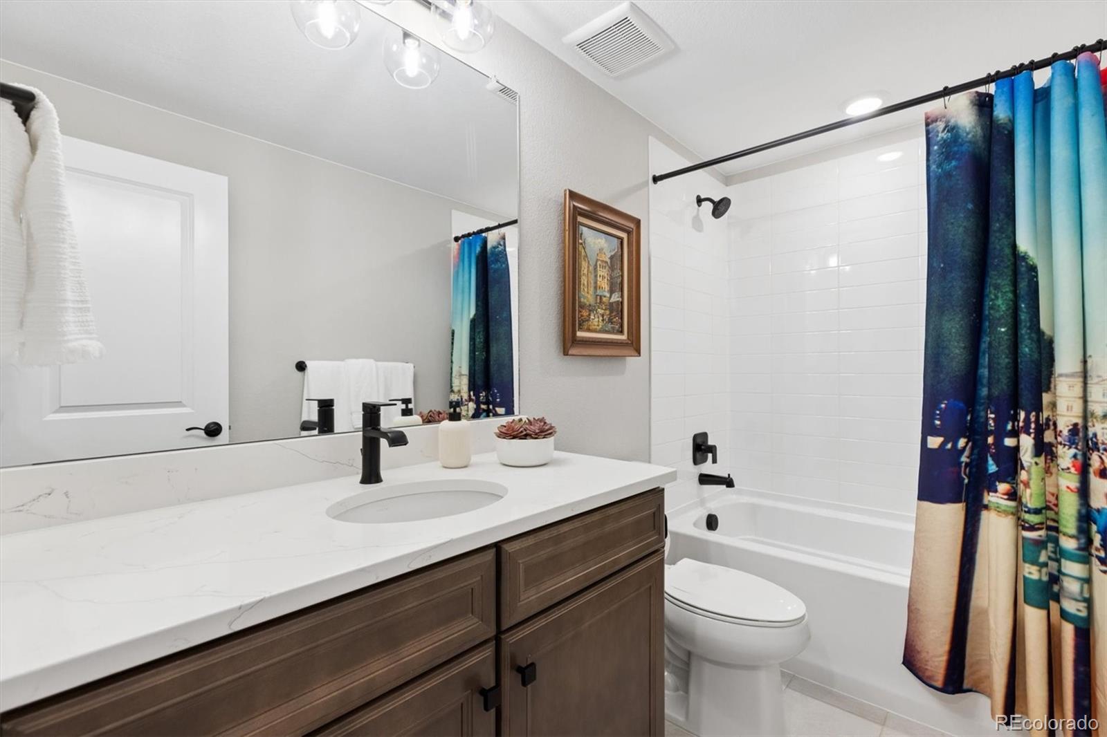 5980 South Platte Canyon Road Littleton, CO 80123 - Photo 40 of 50 a bathroom with a sink a toilet a tub and shower