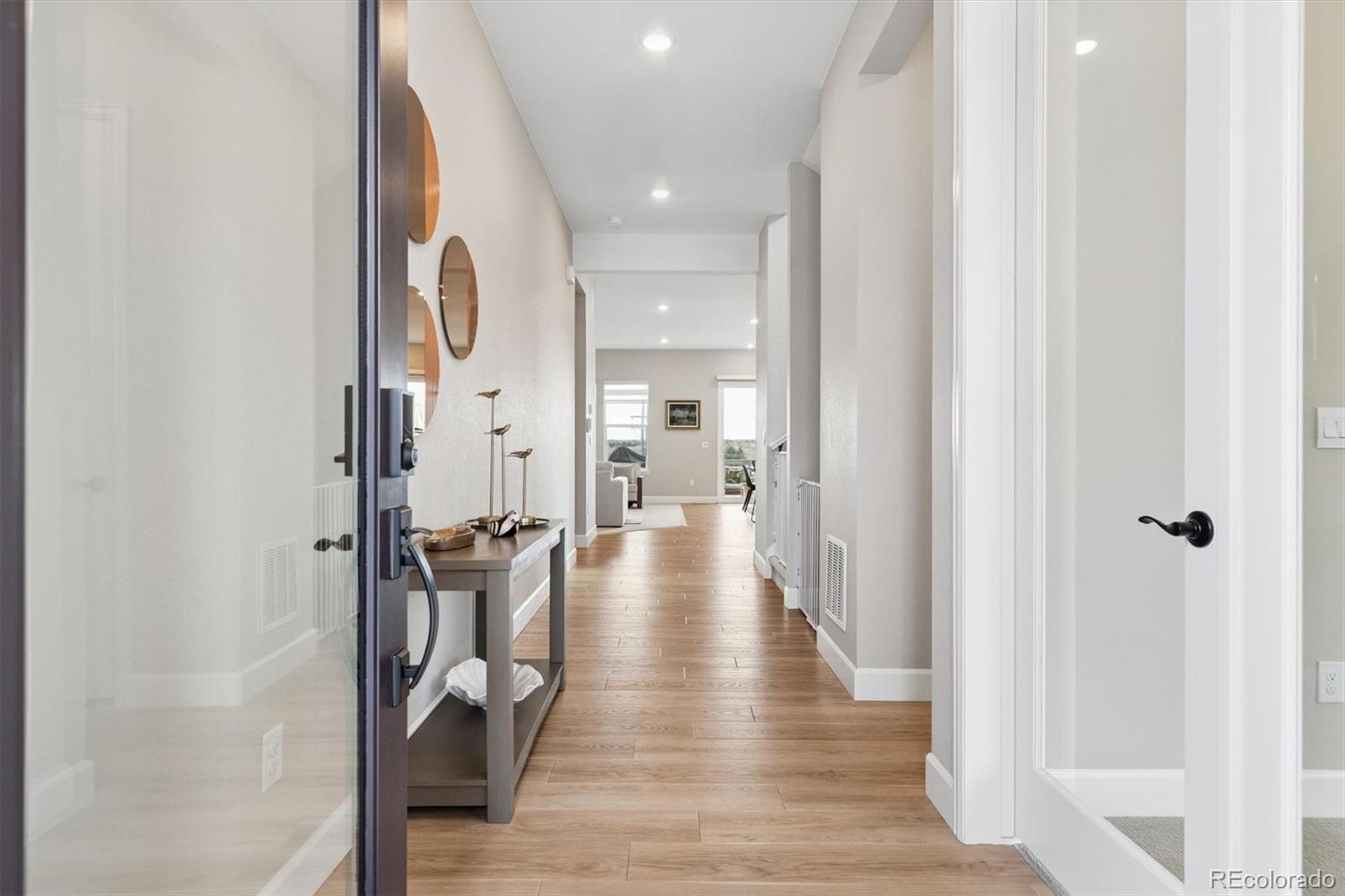 5980 South Platte Canyon Road Littleton, CO 80123 - Photo 8 of 50 a view of a hallway with wooden floor