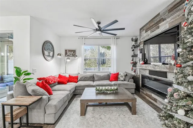 a living room with furniture and a large window