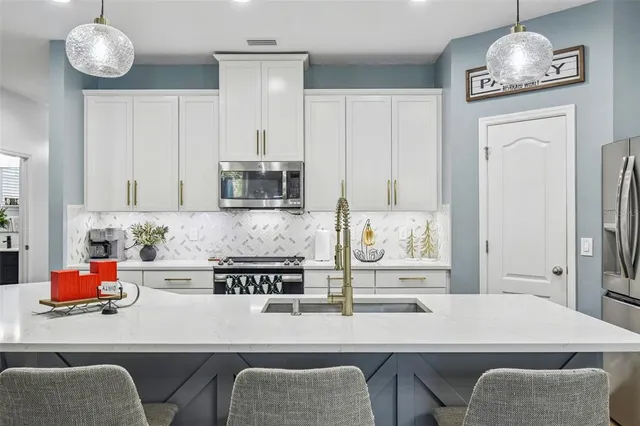 an aerial view of residential houses with outdoor space and street view