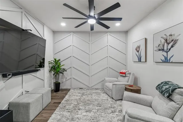 a living room with furniture and a potted plant
