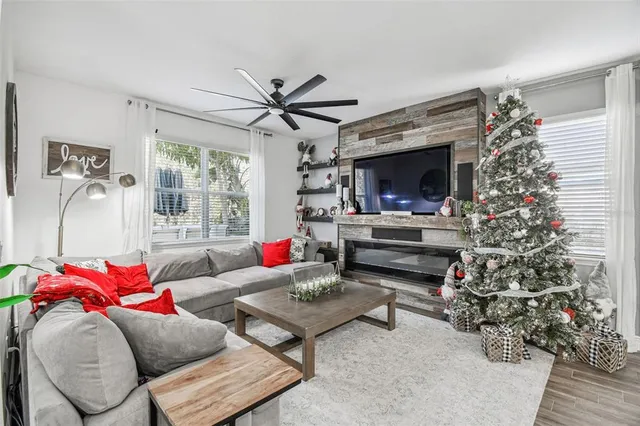 a bedroom with a large bed and a ceiling fan