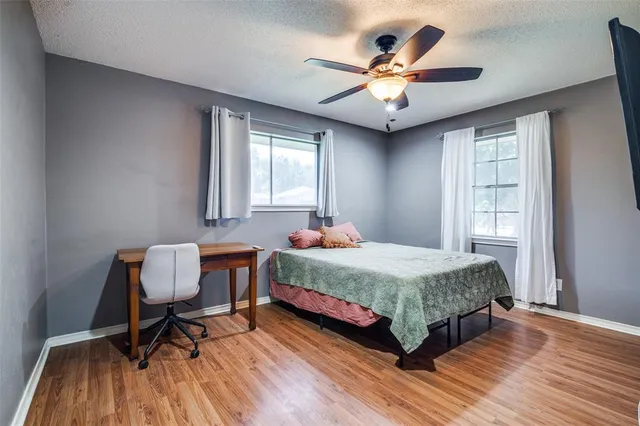 a bedroom with bed and window