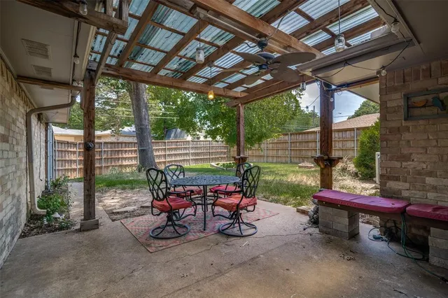 a sitting area with furniture and a bench