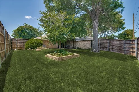 a view of a backyard with a garden