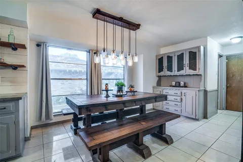 a view of a dining room with furniture and window