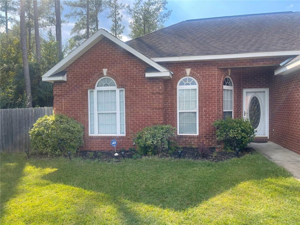 1813 Macon Road Perry, GA 31069 - Photo 1 of 1 a front view of a house with garden
