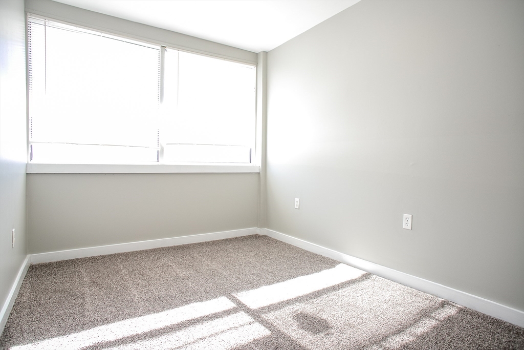 865 South Barre Road Barre, MA 01074 - Photo 13 of 34 a view of empty room with wooden floor and fan